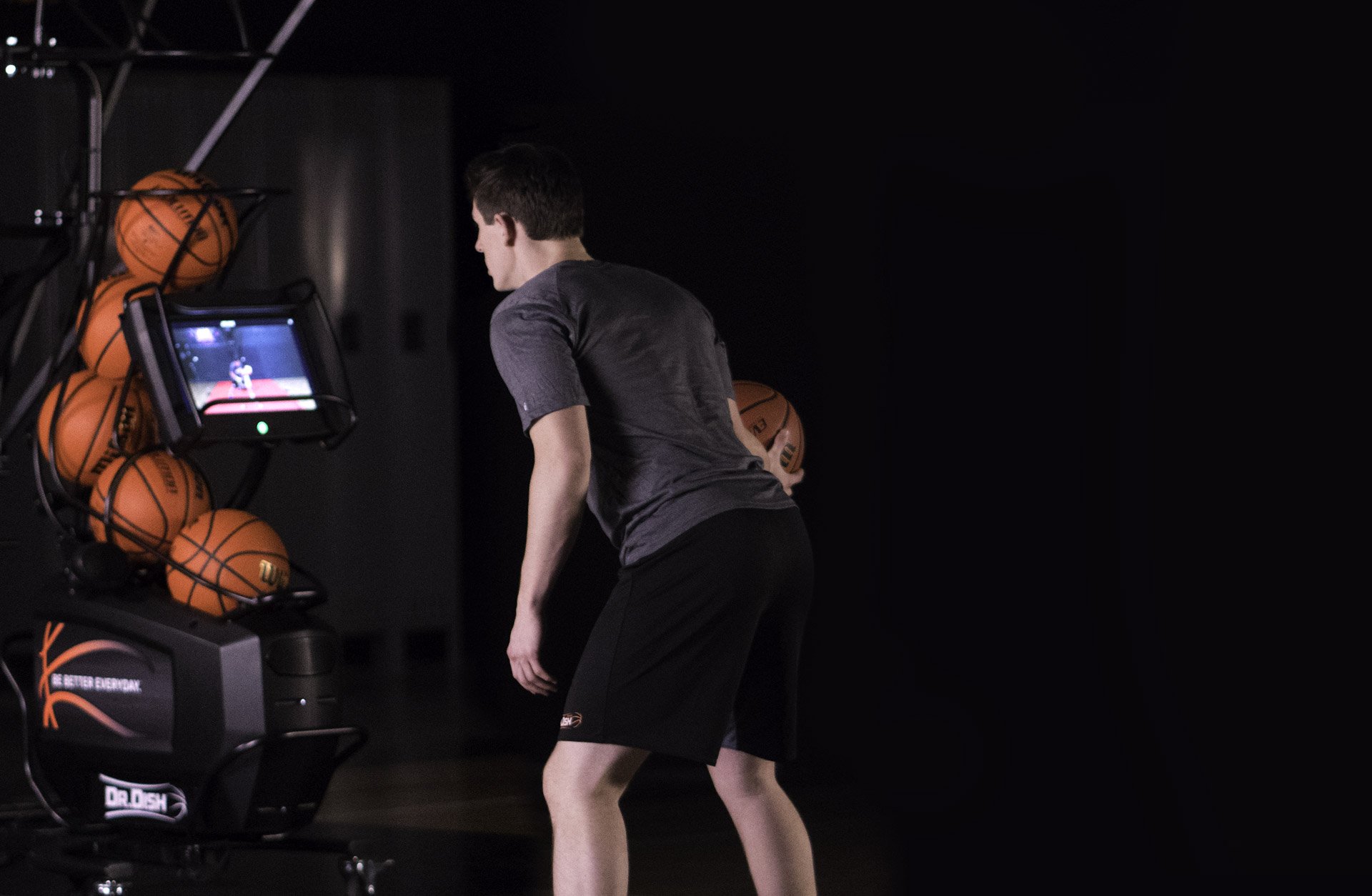 Basketball Player Using Shooting Machine